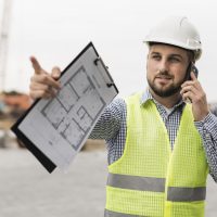 medium-shot-architect-talking-phone medium-shot-architect-talking-phone